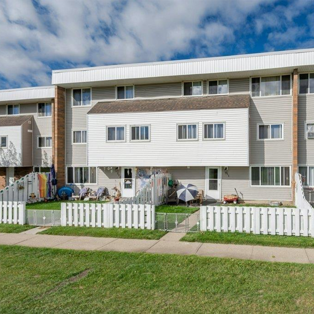 Exterior shot of a townhouse for sale in Central Edmonton.