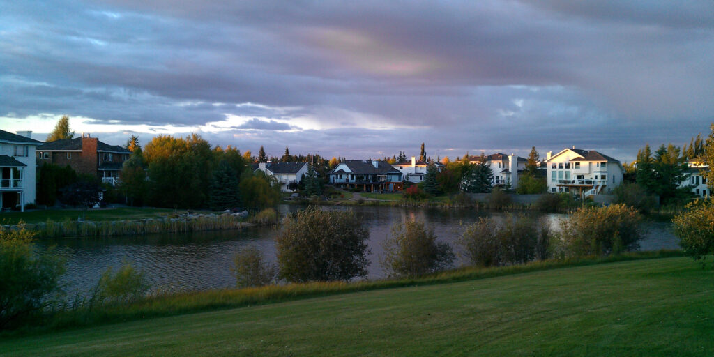 Homes surround a small lake in Sherwood Park, Alberta.