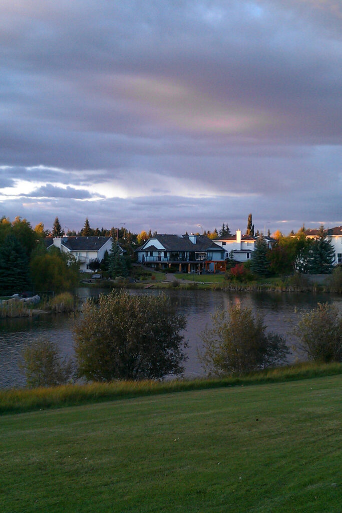 Homes surround a small lake in Sherwood Park, Alberta.