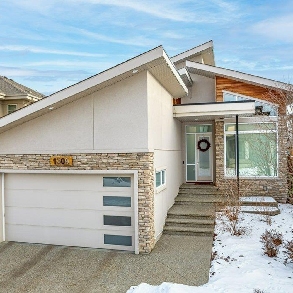 Exterior of an angular, modern home for sale in southwest Edmonton.