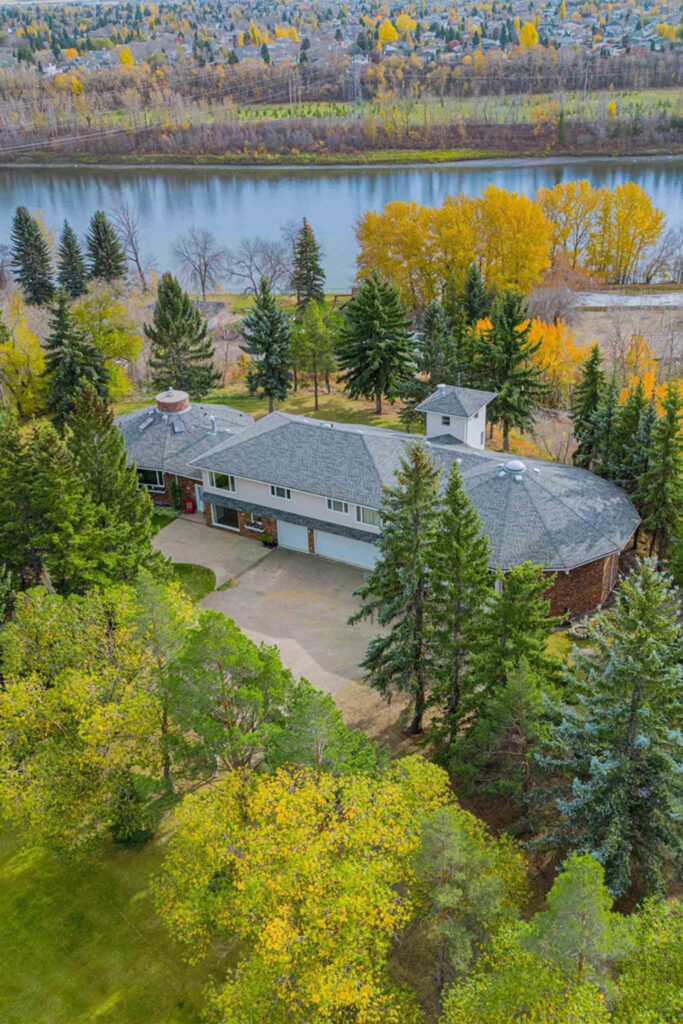 In Sturgeon County, a large home sits on an acreage beside a river.