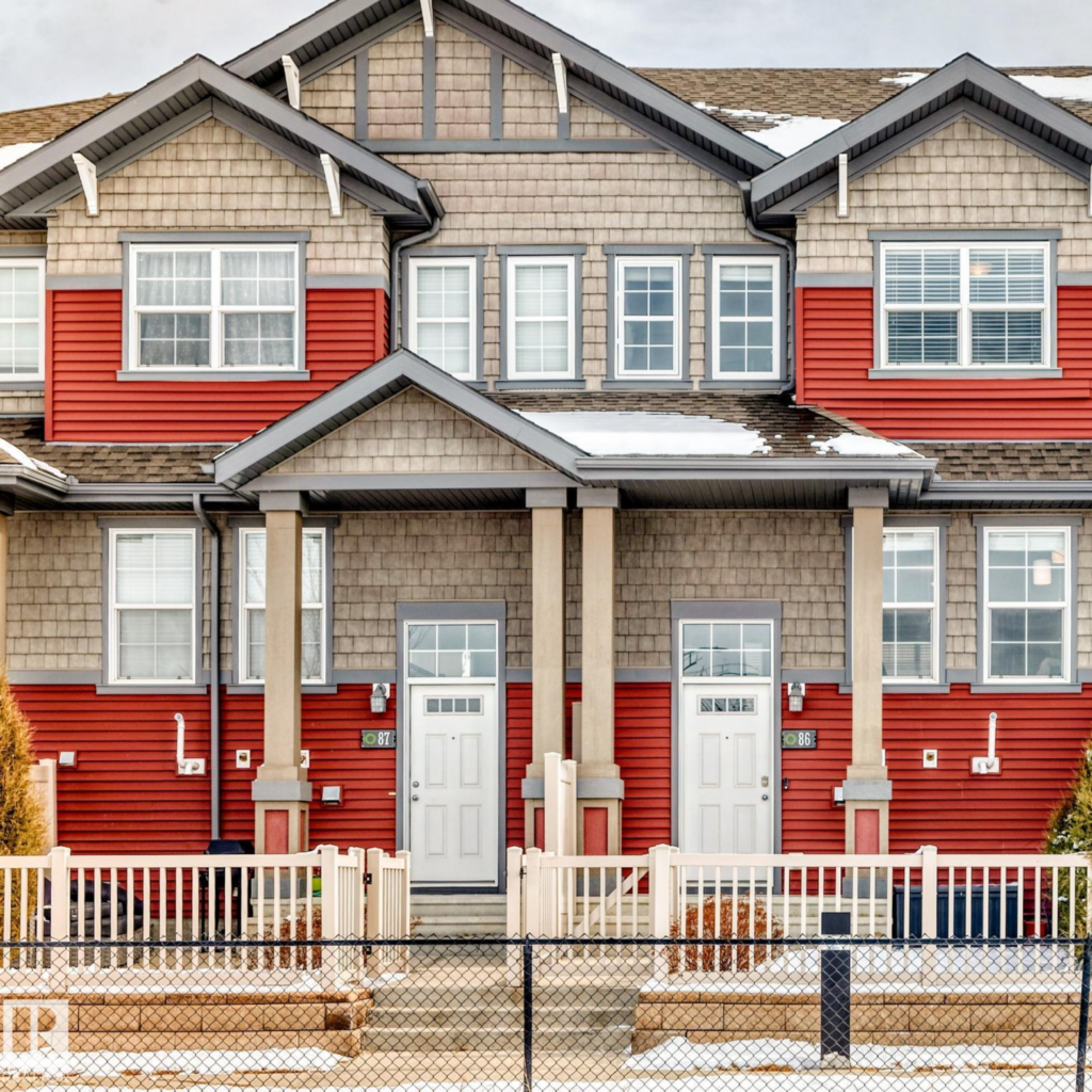 Red and brown townhouses in the Orchards at Ellerslie Edmonton neighbouhood.