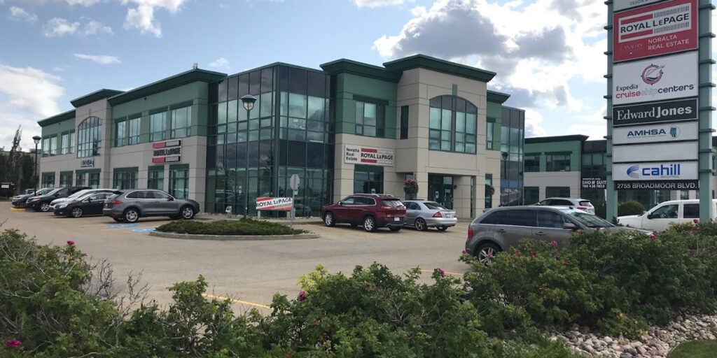 The exterior of our Sherwood Park office from the parking lot. A sign reads 