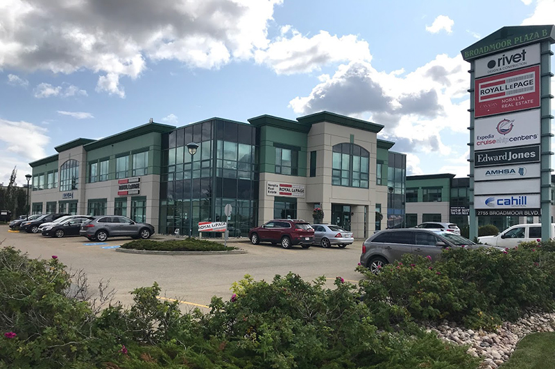 The exterior of our Sherwood Park office from the parking lot. A sign reads 