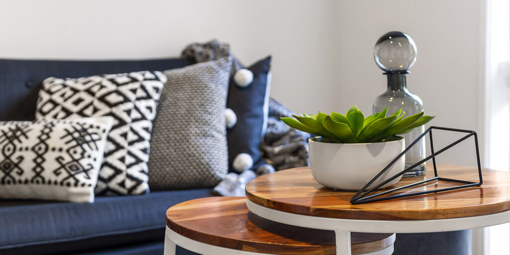 A closeup of coffee table and couch