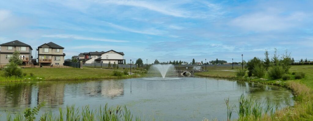 Homes surround a small lake in The Hamptons, Edmonton.