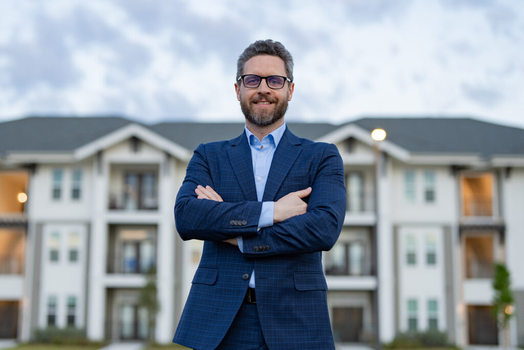 photo of happy man realtor in the suit outdoor at the house