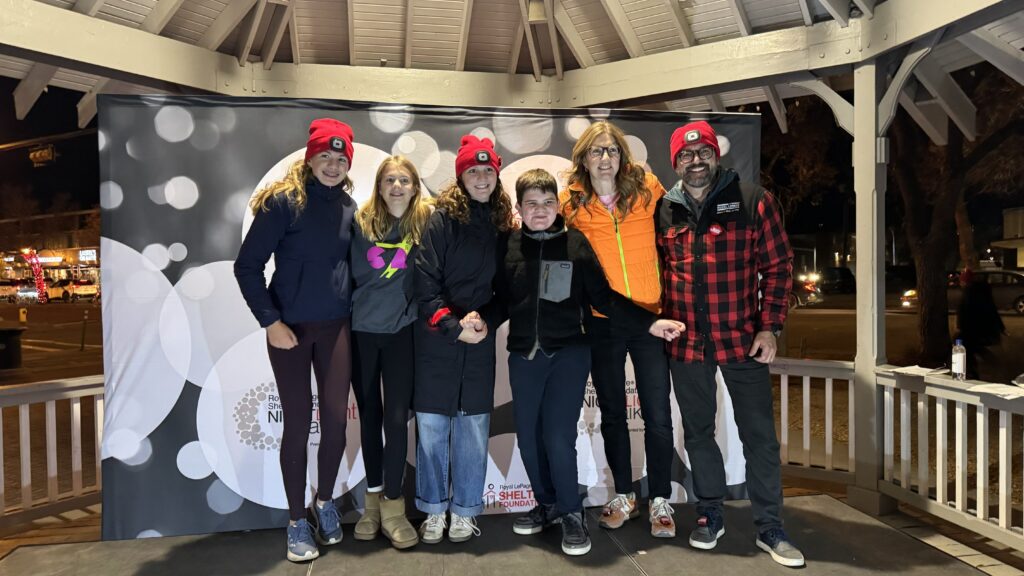 Shearer family standing on stage being recognized at the fundraiser.