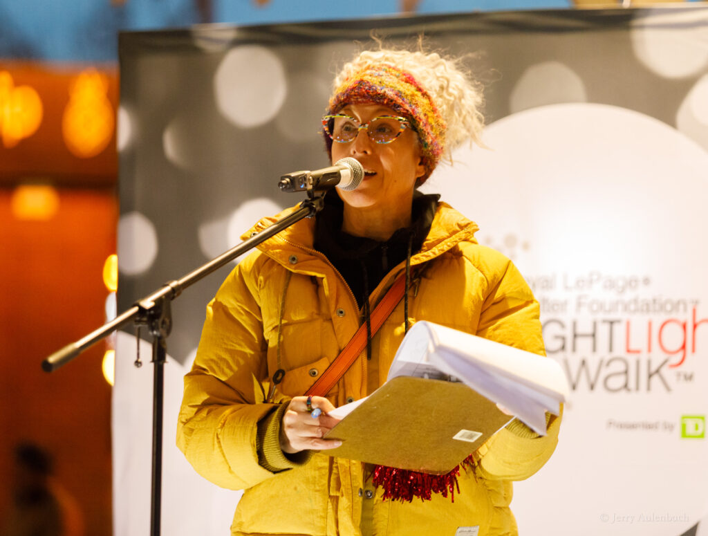 Keynote speaker and MC inspiring the crowd at the Royal LePage Shelter Foundation Night Light Walk Edmonton 2025.
