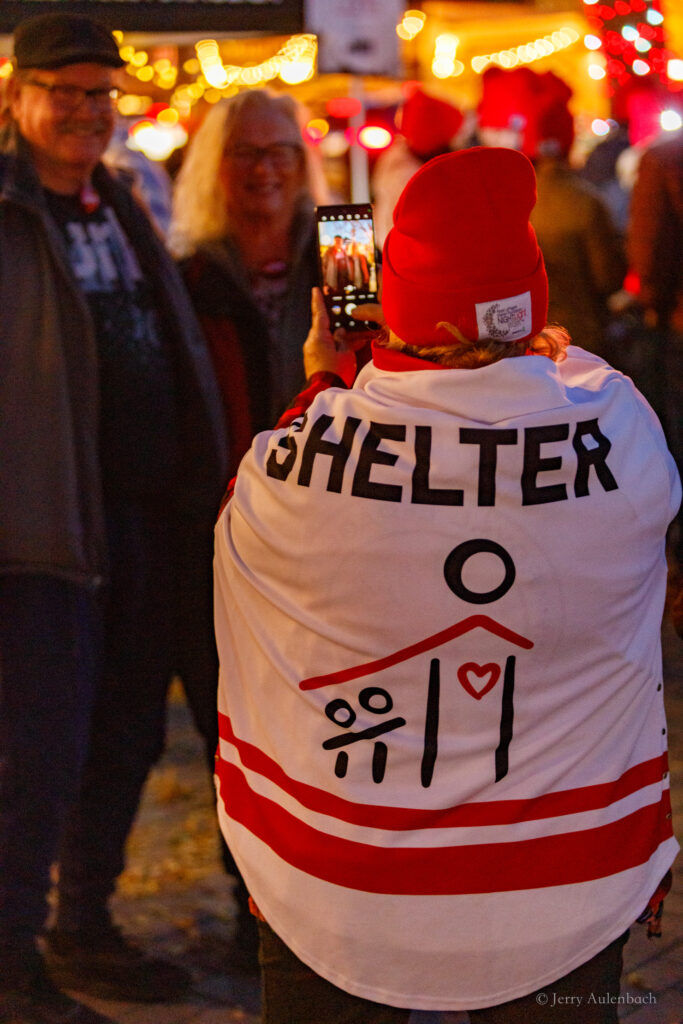 Custom jersey reading “Shelter” displayed proudly at the event.
