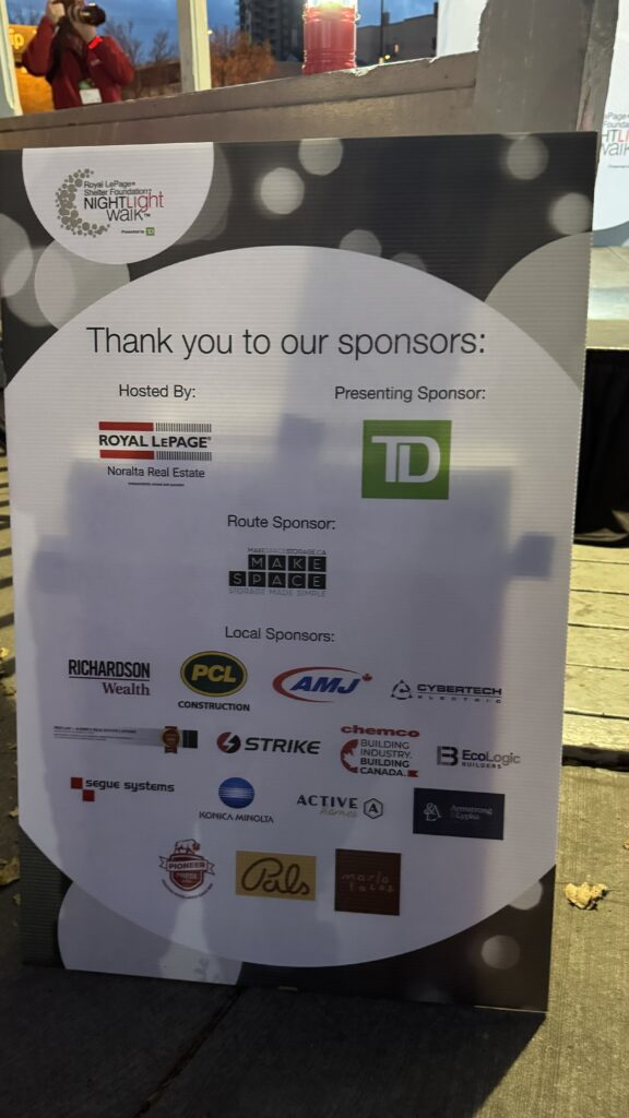Sponsor signage featuring TD, Royal LePage Noralta, Make Space Storage, Richardson Wealth, PCL Construction and more at the Night Light Walk Edmonton 2025.