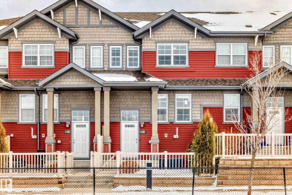 Red and brown townhouses in the Orchards at Ellerslie Edmonton neighbouhood.